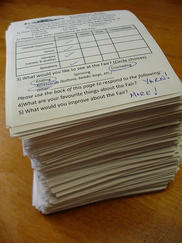 stack of paper surveys
