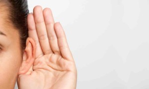 Hand to ear lsitening closely