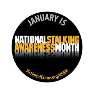 Round black with white writing saying January is National Stalking Awareness Month VIctimsOfCrime.org/NSAM