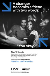 A group of people with drinks in their hands pose for a selfie. Text says "A stranger becomes a friend with two words: 'You Okay?'"